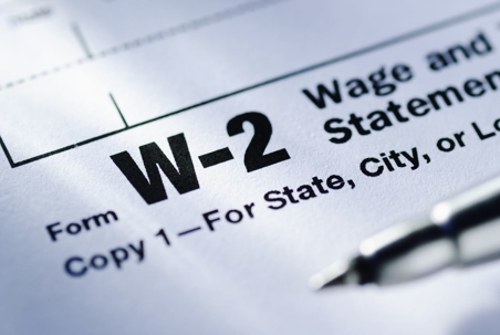 Pen on a Form W-2 Wage and Tax Statement for the US Treasury